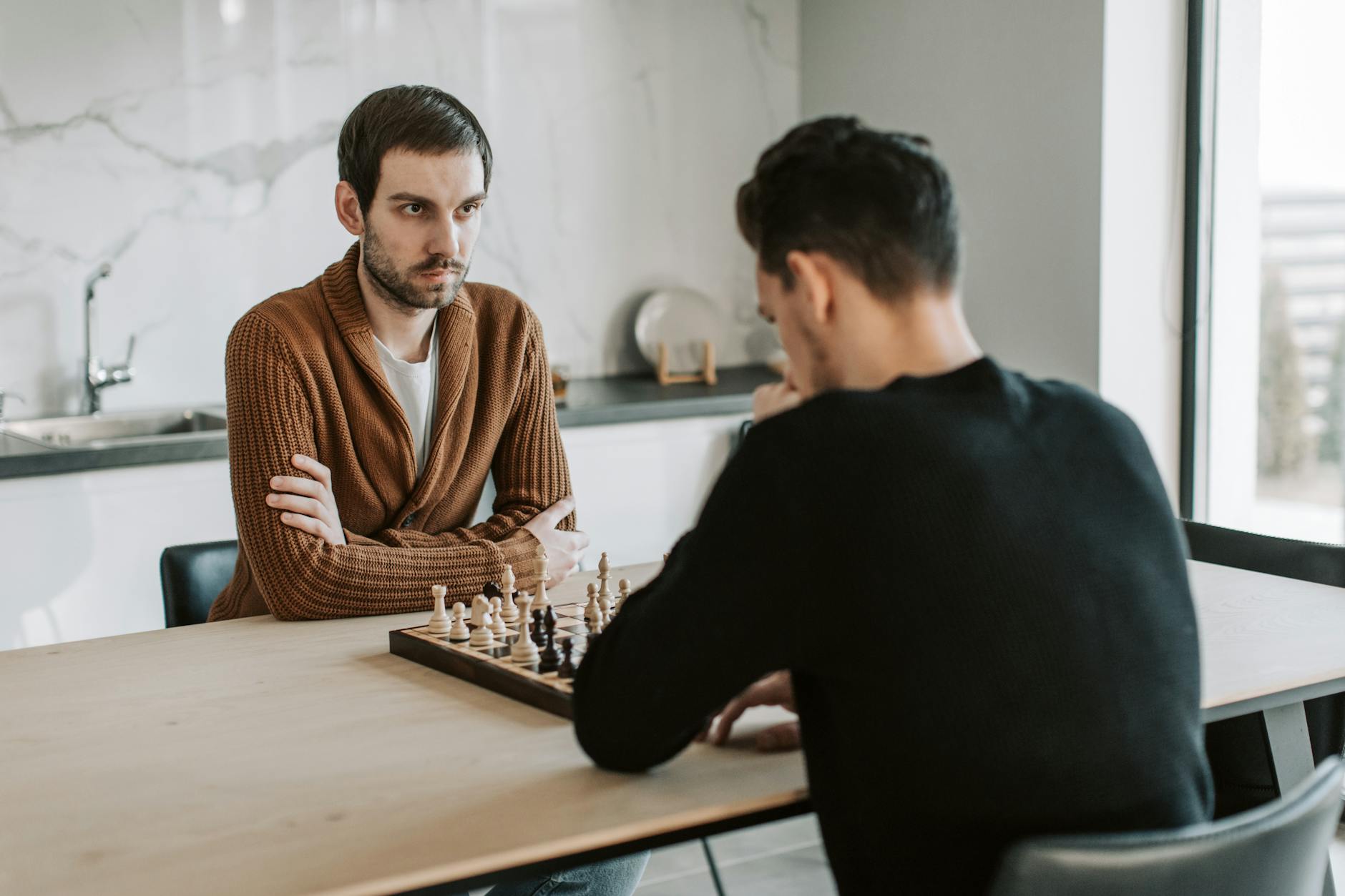 Two friends at chess board